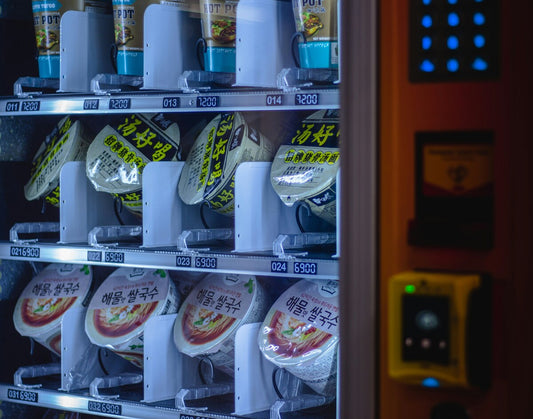 A variety of snacks in the vending machine.