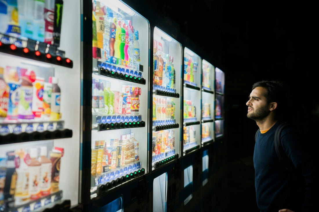 A vending machine owner checking its stocks