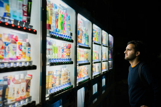 A vending machine owner checking its stocks