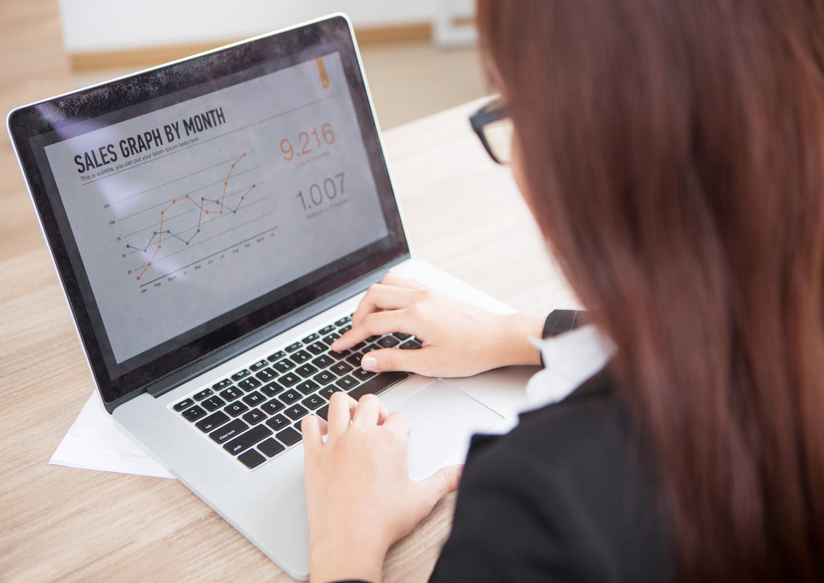A vending machine owner keeps track of stocks and sales of her business